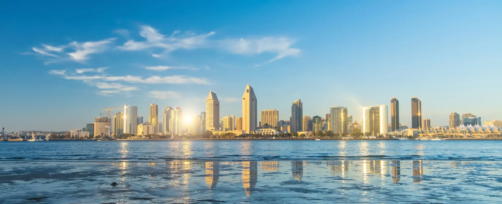 The San Diego skyline at sunrise, seen across the bay